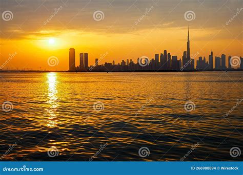 Scenic Sunset Above a Tranquil Beach with the Dubai Skyline in the Background on a Summer Day ...