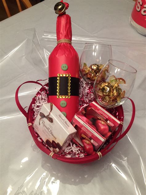 Gift basket for two! Includes bottle of wine (Santa wrap), 2 wine glasses, candle and some ...