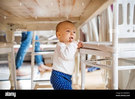 Little girl under table hi-res stock photography and images - Alamy