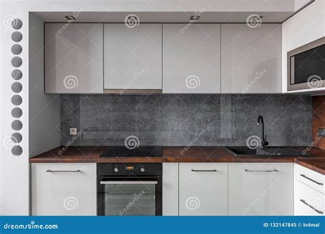 Modern Kitchen with Gray Backsplash Stock Image - Image of granite, interior: 132147845