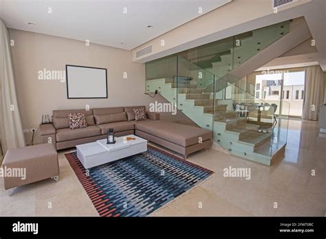 Living room lounge area in luxury duplex apartment show home showing interior design decor ...