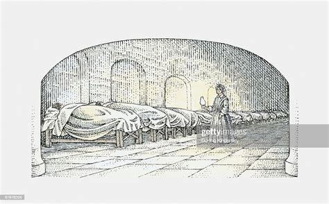 Black And White Illustration Of Florence Nightingale Walking With Lamp Near Beds Of Injured ...