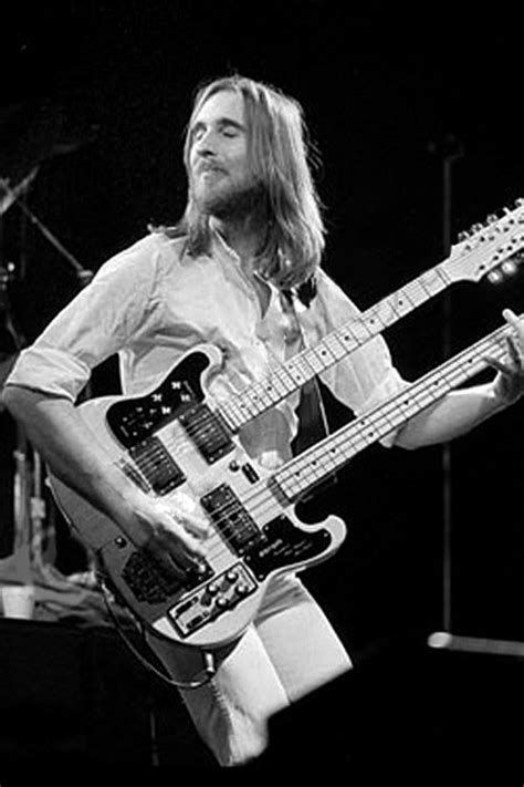 a man playing an electric guitar on stage