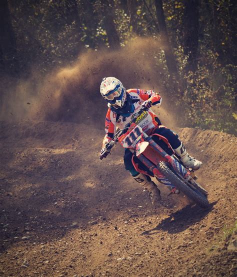 Man in White and Orange Motocross Overall Riding His Motocross Dirt ...