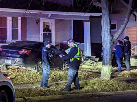 Crash leaves 1 car on its side, another on a house porch in south Fort Wayne | WANE 15