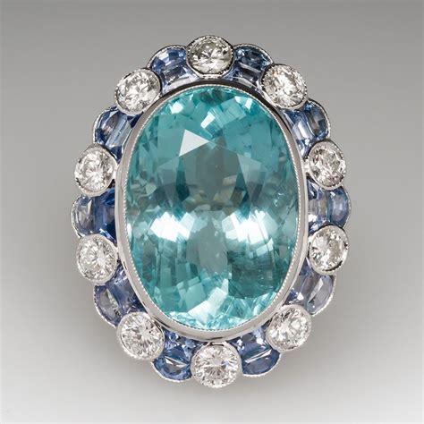 This stunning aquamarine cocktail ring is crafted of 18k white gold and features a 16.75 carat ...