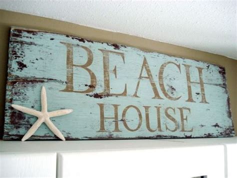 i love everything about this beach house sign: the color, the distressed wood and the sea star ...