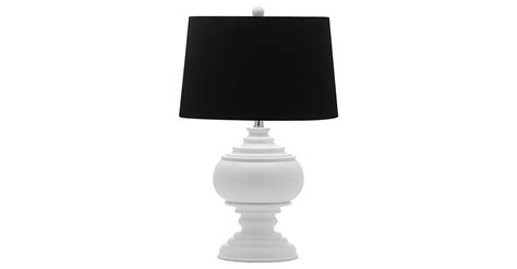 This lamp's classic turned base in creamy white resin is paired with a ...