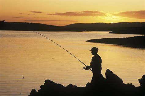 Silhouette Of A Fisherman Fishing On Photograph by The Irish Image ...