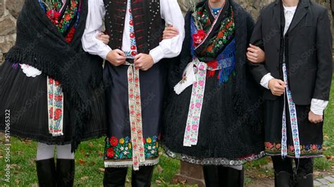 Traditional folk costumes worn by young people in Holloko village in ...