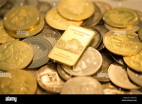 Gold COINS and gold bars Stock Photo - Alamy