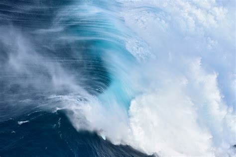 Surfers risk death paddling into historic 80-foot waves at Jaws