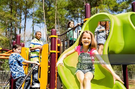 Elementary Children Play At School Recess Or Park On Playground Stock ...