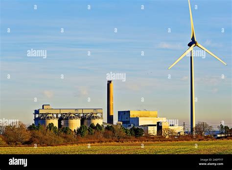 Lynemouth Power Station biomass electricity generator and wind turbine Stock Photo - Alamy