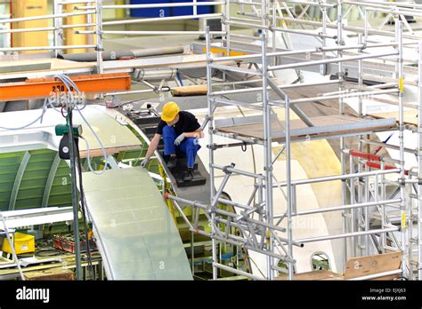 Airplane construction in a hangar Stock Photo - Alamy