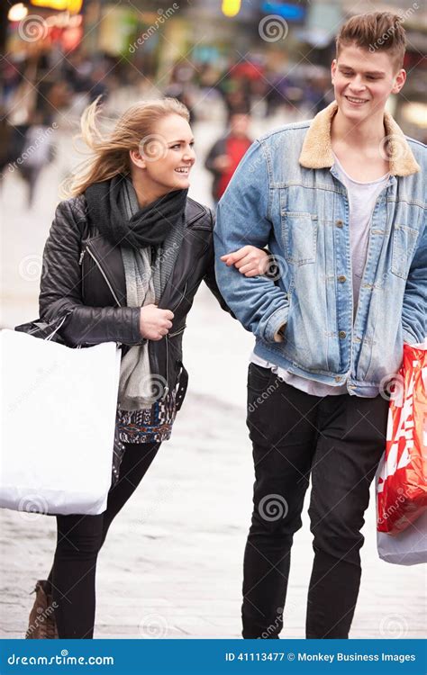 Young Couple Shopping Outdoors Together Stock Image - Image of female, department: 41113477