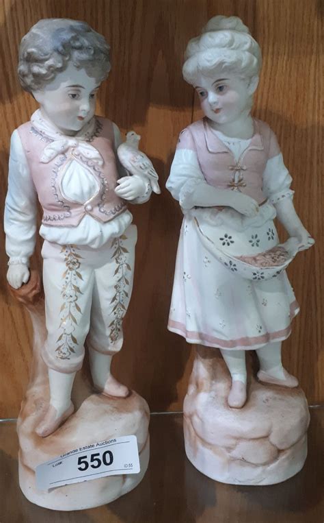 PAIR OF ANTIQUE GERMAN PORCELAIN FIGURINES