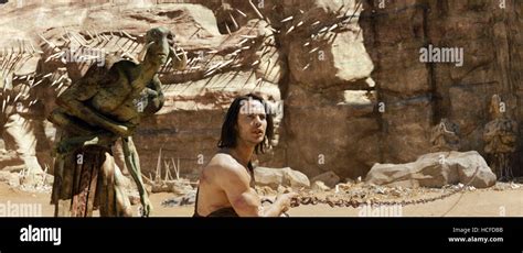 JOHN CARTER, from left: Tars Tarkas (voice: Willem Dafoe), Taylor Kitsch, 2012. ©Walt Disney ...