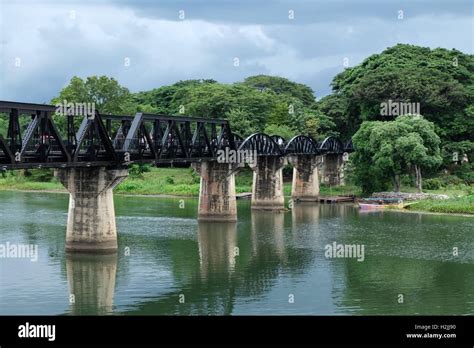 Kanchanaburi Bridge with coming storm Stock Photo - Alamy