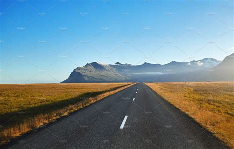 Road in a bright sunny mountain landscape featuring mountains, asphalt, and | Nature Stock ...