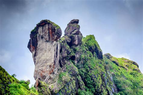 some very tall rocks in the middle of a mountain