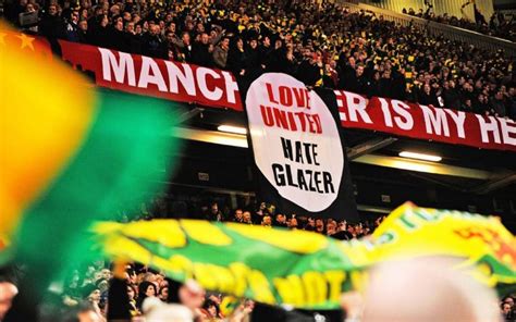 Video: Man United fans fly 'Glazers Out' banner over Leeds