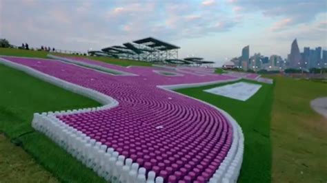 "Qatar's finest" words in Arabic with 35,000 plastic bottles at the Expo site achieves Guinness ...