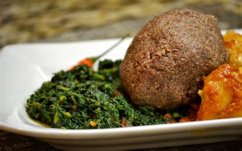 Whole Grain Sorghum Sadza/ Ugali/ Isitshwala/pap served with creamed pumpkin leaves and chicken ...