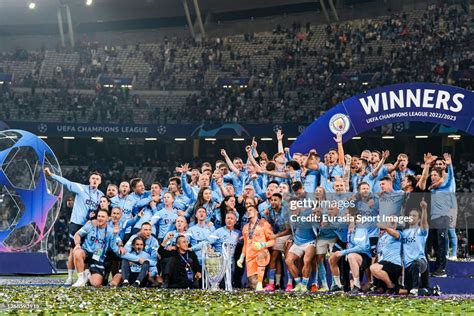 Players of Manchester City celebrate winning the 2023 Champions... News ...