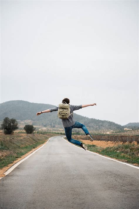 "Man Hitchhiking" by Stocksy Contributor "Milles Studio" - Stocksy