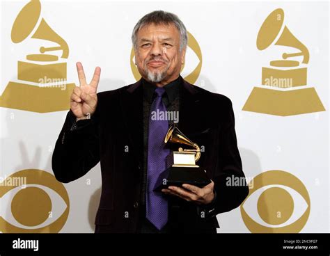 Little Joe of Little Joe y la Familia poses backstage with the award for best tejano album at ...