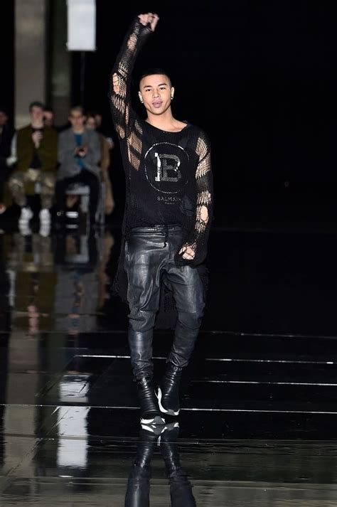 Fashion designer Olivier Rousteing walks the runway during the ...