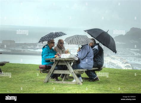 Picnic in the rain. Picnic in bad weather. Picnic by the sea bad ...