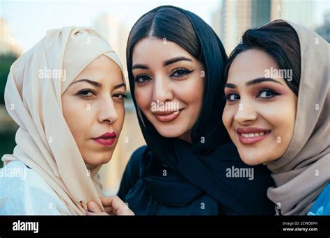 Three women friends going out in Dubai. Girls wearing the united arab ...