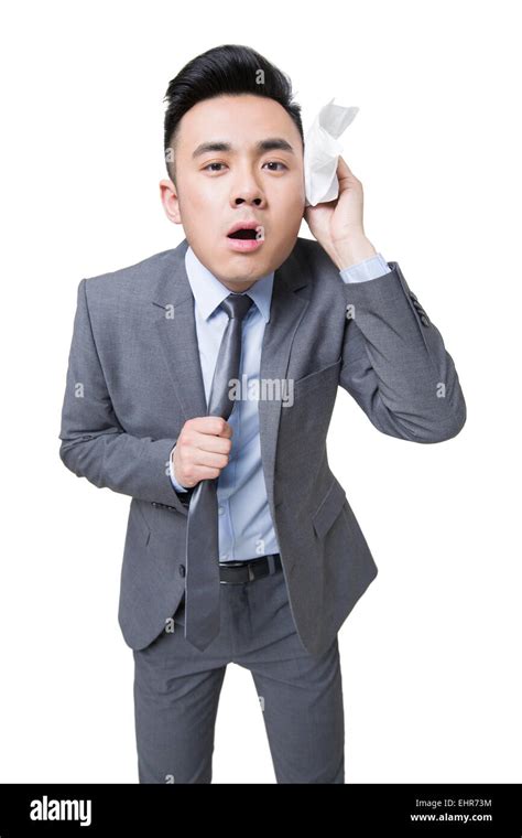 Nervous businessman wiping sweat Stock Photo - Alamy