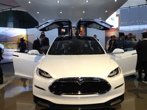 2014 Tesla Model X The gull wing doors on the Tesla Model x captures the imagination of families ...