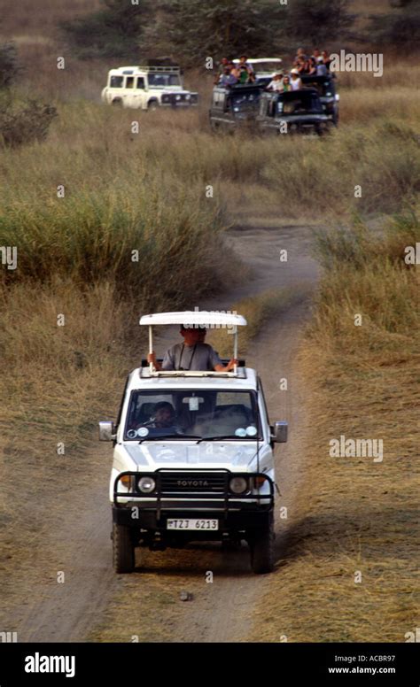 Land Rover on safari in Serengeti National Park Tanzania East Africa ...