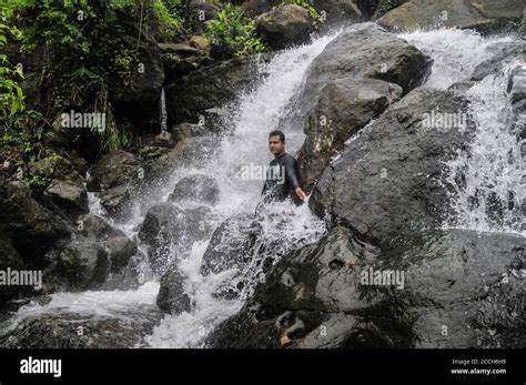 Tourists enjoying the hilly 'Mayabi Jhorna' waterfalls located at the ...