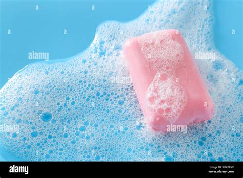 Soap bar on color background Stock Photo - Alamy