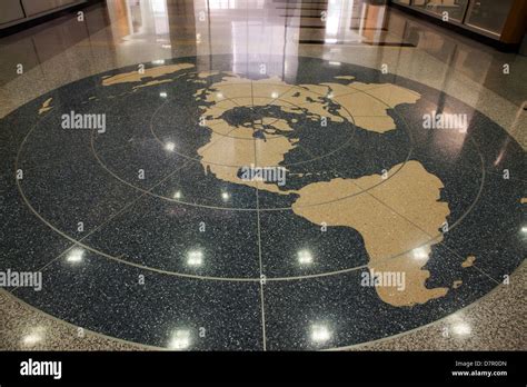 Circular world map on building lobby floor Stock Photo - Alamy