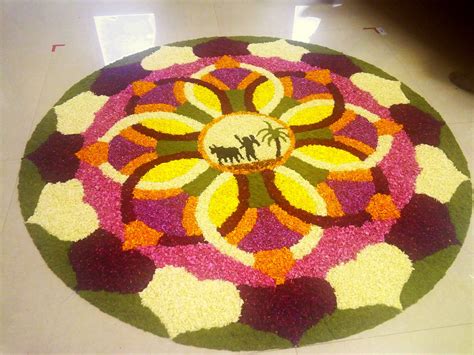 a colorful circular rug with an elephant and palm tree on the center is decorated in multicolors