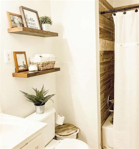 White Bathroom with Floating Shelves Over Toilet - Soul & Lane