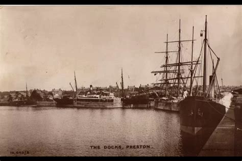 an old black and white photo of several ships in the water near a dock ...