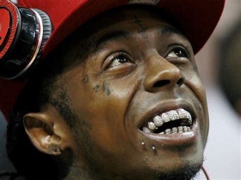 Lil Wayne: Wonder how much those teeth cost!