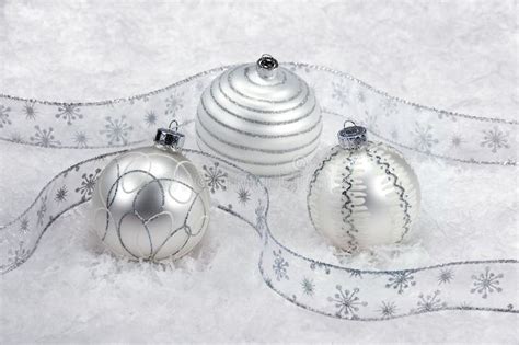 Three White And Silver Christmas Ornaments On Snow Stock Image - Image ...