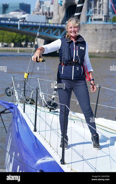 Sailor Pip Hare pours champagne during the official naming of her new Vendee Globe boat Medallia ...