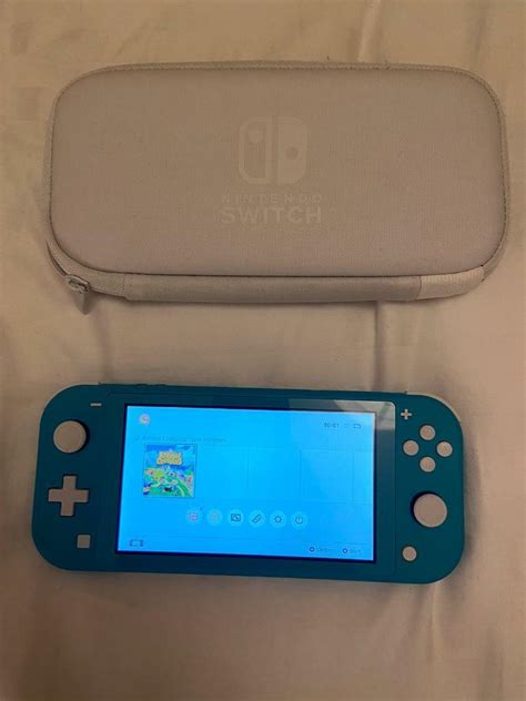 Nintendo switch lite turquoise - excellent condition - only a few ...