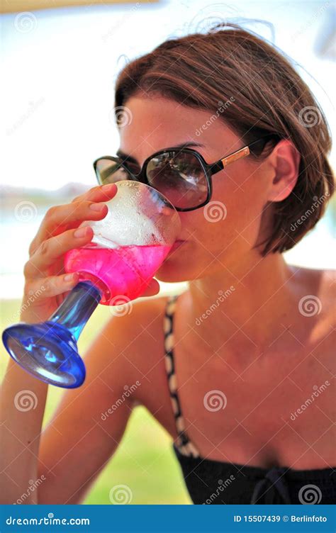 Woman drinking cocktail stock image. Image of closeup - 15507439