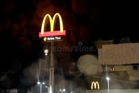 McDonald`s Logo at Night during Rainy Weather. Editorial Stock Image ...