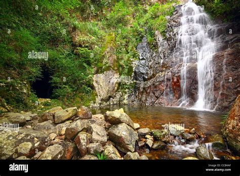 waterfall and mountain cave Stock Photo - Alamy